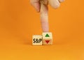 S and P 500 Index symbol. Businessman turns a cube, changes the direction of an arrow symbolizing that the S and P500 Index is Royalty Free Stock Photo