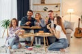 It`s pizza time. Group of friends have party indoors together Royalty Free Stock Photo