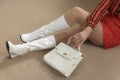 1960s plastic handbag and white boots Royalty Free Stock Photo