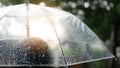 raining, Women walk in the rain. Hand of women holding an umbrella. She feel sad, Sky have a drizzling and overcast all the Royalty Free Stock Photo