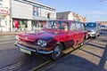 A red Triumph 2000 Mark 1 station wagon