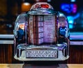 A 1960s retro looking mini jukebox radio on a tabletop, Royalty Free Stock Photo