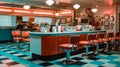 1970\'s retro style diner with checkered floor and red stools. Empty business with no people Royalty Free Stock Photo