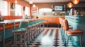 1970\'s retro style diner with checkered floor and red stools. Empty business with no people Royalty Free Stock Photo