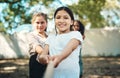 That's right, girls are super strong. Shot of a group of teenagers playing a game of tug of war at summer camp. Royalty Free Stock Photo