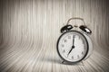 It`s seven o`clock already, time to wake up for breakfast, vintage old black metallic alarm clock Royalty Free Stock Photo