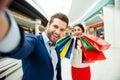 It`s shopping and fun time. Cute selfie portrait of cheerful su Royalty Free Stock Photo