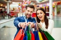 It`s shopping and fun time. Portrait of cheerful successful ha Royalty Free Stock Photo