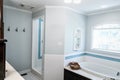 1950`s style bathroom with tile floor and dark brown cabinets in white and blue accents Royalty Free Stock Photo