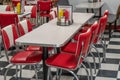 50s style diner with red and white chairs