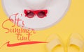 It`s Summer Time text on yellow background,  summer sandals, white hat and sunglasses Royalty Free Stock Photo