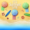 It`s summer time. Top view of stuff on the beach - umbrellas, towels, surfboards, ball, lifebuoy, slipper and starfish on a sunny