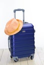 It`s summer time. Travel bag and straw hat. Royalty Free Stock Photo