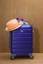 It`s summer time. Travel bag and straw hat. Royalty Free Stock Photo