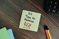 It\'s Time to Minimize Risk write on sticky notes isolated on Wooden Table