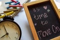 It`s time to move on phrase colorful handwritten on chalkboard, alarm clock with motivation and education concepts. Royalty Free Stock Photo