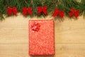 New Year / Christmas gifts in package, tree with red bows on the wooden background template Royalty Free Stock Photo