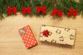 New Year / Christmas gifts in package, tree with red bows on the wooden background template Royalty Free Stock Photo