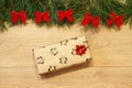 New Year / Christmas gifts in package, tree with red bows on the wooden background template Royalty Free Stock Photo