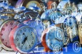 It`s time to protect your data - Concept image with old colored metal table clocks with binary code Royalty Free Stock Photo