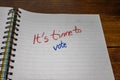 It`s time to vote, handwriting text on paper, political message. Political text on office agenda. Concept of democracy, voting,