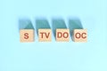 S TV DO OC basic sentence pattern English grammar concept. Wooden blocks flat lay on blue background.