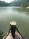 View the beautiful scenery of the lake on the handrail of the plank road by the lake Royalty Free Stock Photo