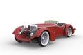 1920s vintage concept convertible roadster sports car with red paintwork and whitewall tyres. 3D rendering isolated on white Royalty Free Stock Photo