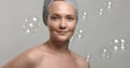 30`s woman wears a towel after bath surrounded by soap bubbles Royalty Free Stock Photo