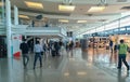 Sa Carneiro airport interior view, departures and arrivals,inside shopping stores and people walking with suitcases and bags, Royalty Free Stock Photo