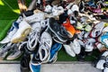 A pile of used shoes in the second hand shoe shop at Rong Kluea Market Royalty Free Stock Photo