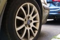 The SAAB company logo is on the rim of a car wheel.