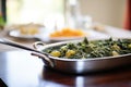 saag aloo in a buffet setting with serving spoon Royalty Free Stock Photo