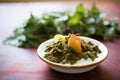 saag aloo with a dollop of yogurt on top Royalty Free Stock Photo