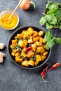 Saag Aloo, Indian style spinach and potatoes in cast iron pan. Top view Royalty Free Stock Photo