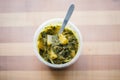 saag aloo in a takeout container with a fork Royalty Free Stock Photo