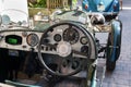 Vintage Alvis oldsmobile veteran car standing on street