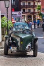 Vintage Alvis oldsmobile veteran car standing on street