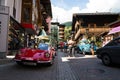 People looking at Ferrari Dino oldsmobile vintage veteran cars preparing for Saalbach Classic rally in Saalbach-Hinterglemm, Aust Royalty Free Stock Photo