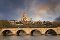 Saarbrucken Bridge and Sameba Cathedral in Tbilisi, Georgia. Royalty Free Stock Photo