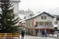 Saas Fee, Switzerland - February 4, 2020: Tourists walking on street of mountain resort town in Switzerland, Europe. Winter