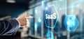SaaS software as a service concept with hand pressing a button Royalty Free Stock Photo