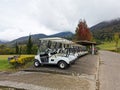 Outdoor scenery during day time with a row of golf carts. Royalty Free Stock Photo