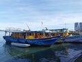 Outdoor scenery during day time with fisherman boats and ships near Todak Waterfront.