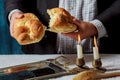 Sabbath challahs candlesticks with lit candles, and challah