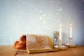 Sabbath image. challah bread and candelas on wooden table