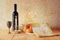 Sabbath image. challah bread and candelas on wooden table. glitter overlay Royalty Free Stock Photo