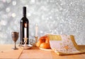 Sabbath image. challah bread and candelas on wooden table. glitter overlay Royalty Free Stock Photo