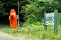 Sacandaga River orange kayak boat & wooden sign, Saratoga county, New York, USA