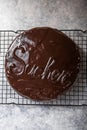 Sacher cake. Traditional Austrian chocolate dessert. Homemade baking. Selective focus, close-up Royalty Free Stock Photo